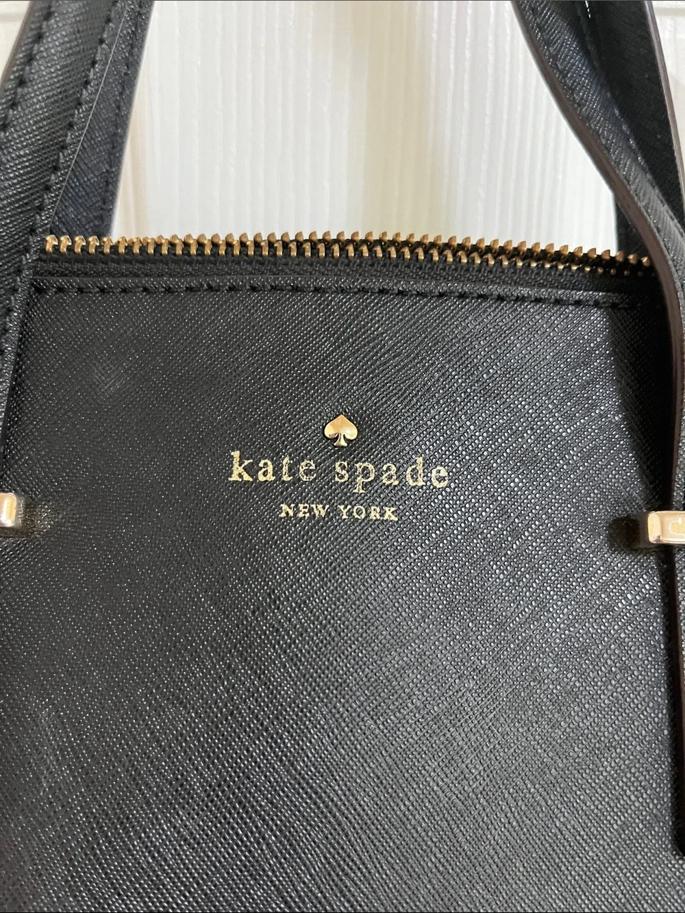 kate spade black leather satchel with gold-tone hardware